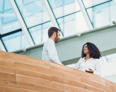 two people shaking hands in a stairwell